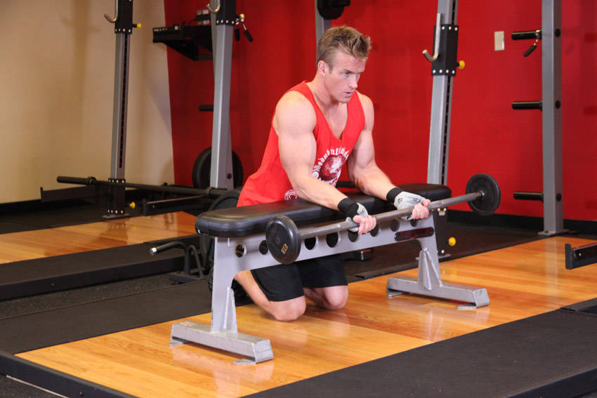 Palms-Up Barbell Wrist Curl Over A Bench